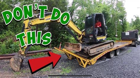 how to unload a mini excavator|how to unload excavators from trailer.